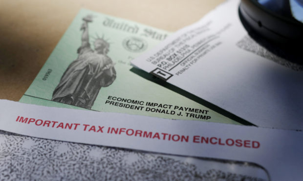 In this April 23, 2020, photo, President Donald Trump's name is seen on a stimulus check issued by ...
