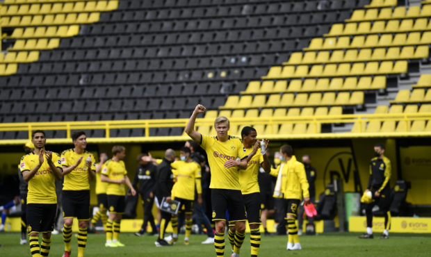 Dortmund's Erling Haaland, center, and his teammates celebrate at the end of the German Bundesliga ...