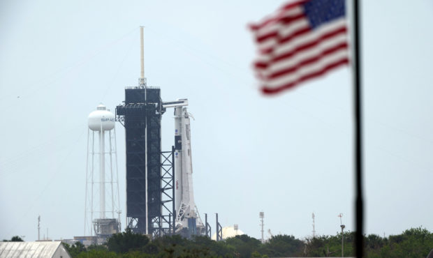 The SpaceX Falcon 9, with the Crew Dragon spacecraft on top of the rocket, sits on Launch Pad 39-A,...