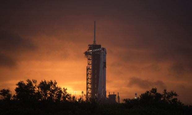 A SpaceX Falcon 9 rocket with the company's Crew Dragon spacecraft onboard is seen on the launch pa...