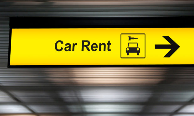 sign with arrow point to rent a car service at the airport for passenger who want to hide a car for...