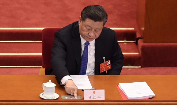 Chinese President Xi Jinping votes on a proposal to draft a security law on Hong Kong during the cl...