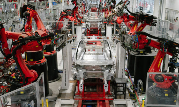 FREMONT, CA - JULY 26: Kuka robots work on Tesla Model X in the Tesla factory in Fremont, Californi...