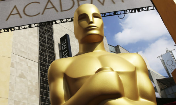 FILE - In this Feb. 21, 2015 file photo, an Oscar statue appears outside the Dolby Theatre for the ...