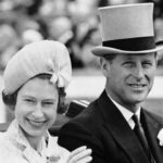 FILE - In this June 19, 1962 file photo, Britain's Prince Philip and his wife Queen Elizabeth II arrive at Royal Ascot race meeting, England. There certainly won’t be fuss. Count on that. When Britain’s Prince Philip reaches the grand age of 99 on Wednesday, he will spend it quietly and in much the same way he’s spent most of his adult life: beside Queen Elizabeth II. (AP Photo/File)