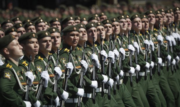 Russian soldiers march toward Red Square during the Victory Day military parade marking the 75th an...