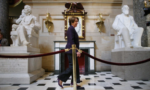 House Minority Leader Nancy Pelosi (D-CA) walks past sculptures of Alexander Hamilton Stephens (L) ...