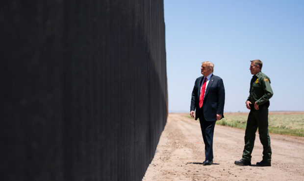 United State Border Patrol chief Rodney Scott gives President Donald Trump a tour of a section of t...