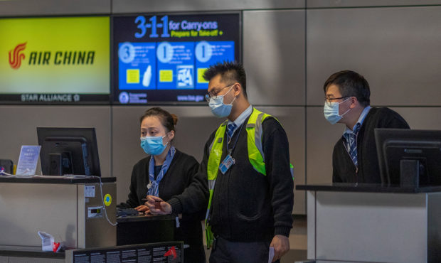 LOS ANGELES, CA - FEBRUARY 02: Air China employees wear medical masks for protection against the no...