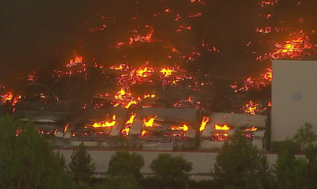 Fire tears through Amazon distribution center in Redlands, California...