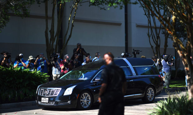 TOPSHOT - People looks as the casket with George Floyd arrives at the Fountain of Praise church whe...