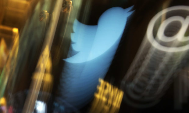 FILE - In this Wednesday Nov. 6, 2013, file photo, the Twitter logo appears on an updated phone pos...