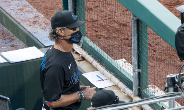 Miami Marlins' manager Don Mattingly looks out from the dugout during the eighth inning of a baseba...