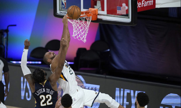 Utah Jazz's Rudy Gobert (27) is unable to score as New Orleans Pelicans' Derrick Favors (22) defend...