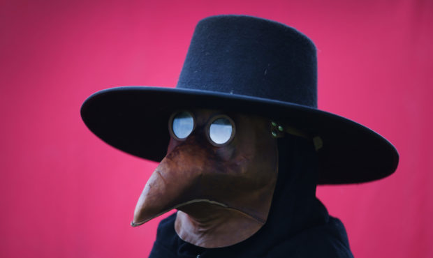 FILE --  A man dresses as a plague doctor at the Bannockburn Live event on June 28, 2014 in Stirlin...