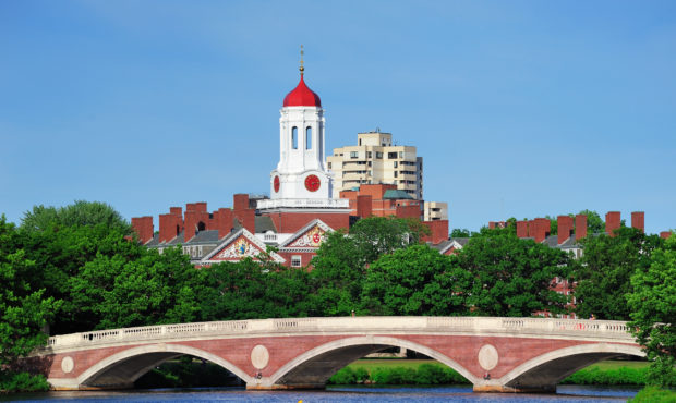 John W. Weeks Bridge and clock tower over Charles River in Harvard University campus in Boston with...