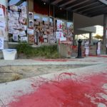 Protesters spread red paint and put up posters outside the office of Salt Lake County District Attorney Sim Gill on July 9, 2020. Photo: Paul Nelson, KSL NewsRadio 