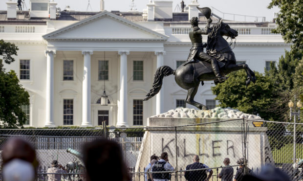 The White House is visible behind a statue of President Andrew Jackson in Lafayette Park, Tuesday, ...