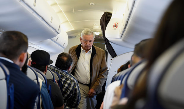 Mexican President Andres Manuel Lopez Obrador boards a commercial flight bound for Culiacan, at Mex...