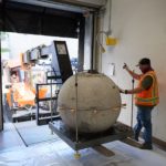 Workers move the capstone of the Salt Lake Temple onto the loading dock at the Church History Library on May 18, 2020. | Intellectual Resrerve