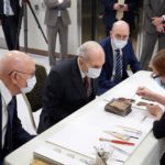 Emiline Twitchell, a conservator at the Church History Library, shows contents from the capstone of the Salt Lake Temple to the First Presidency on May 20, 2020. | Intellectual Reserve