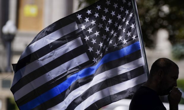 An unidentified man participates in a Blue Lives Matter rally Sunday, Aug. 30, 2020, in Kenosha, Wi...