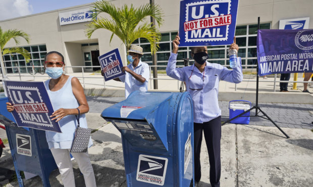 Protesters demonstrate during a "National Day of Action to Save the "Peoples" Post Office!" outside...