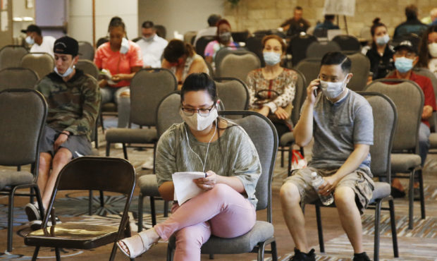 FILE - People wait to speak with representatives from the Oklahoma Employment Security Commission a...