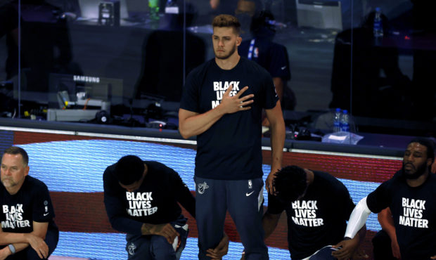 Miami Heat's Meyers Leonard stands during the national anthem before an NBA basketball game against...