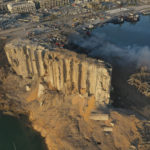 In this drone picture, the destroyed silo sits in rubble and debris after an explosion at the seaport of Beirut, Lebanon, Lebanon, Wednesday, Aug. 5, 2020. The massive explosion rocked Beirut on Tuesday, flattening much of the city's port, damaging buildings across the capital and sending a giant mushroom cloud into the sky. (AP Photo/Hussein Malla)
