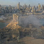 A drone picture shows the scene of an explosion at the seaport of Beirut, Lebanon, Wednesday, Aug. 5, 2020. A massive explosion rocked Beirut on Tuesday, flattening much of the city's port, damaging buildings across the capital and sending a giant mushroom cloud into the sky. More than 70 people were killed and 3,000 injured, with bodies buried in the rubble, officials said. (AP Photo/Hussein Malla)