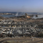 This photo shows a general view of the scene of an explosion that hit the seaport of Beirut, Lebanon, Wednesday, Aug. 5, 2020. A massive explosion rocked Beirut on Tuesday, flattening much of the city's port, damaging buildings across the capital and sending a giant mushroom cloud into the sky. (AP Photo/Bilal Hussein)
