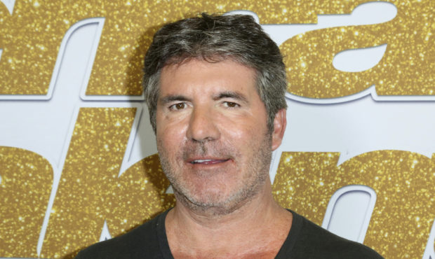 Simon Cowell injures back while testing electric bicycle...
