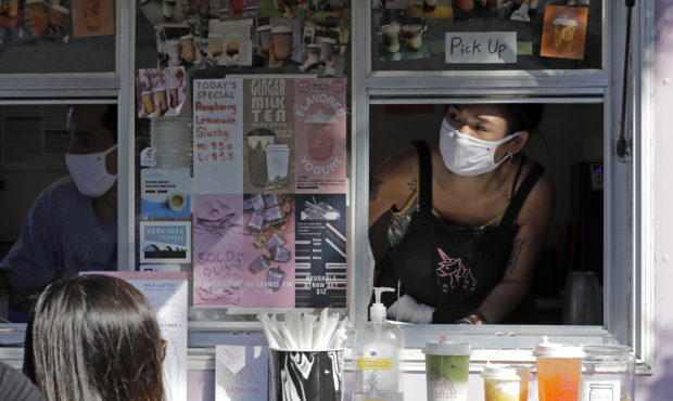 Kaye Fan, right, calls out orders as she works in her Dreamy Drinks food truck, Monday, Aug. 10, 20...