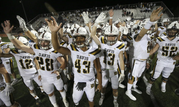 Davis players wave rather shake hands with Herriman due to COVID-19 in Herriman on Thursday, Aug. 1...