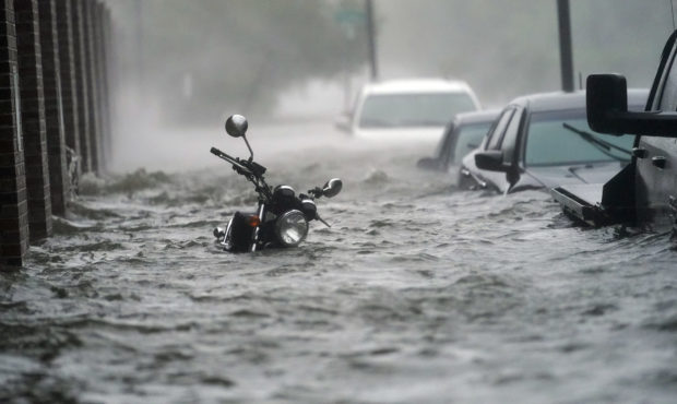 Floodwaters move on the street, Wednesday, Sept. 16, 2020, in Pensacola, Fla. Hurricane Sally made ...