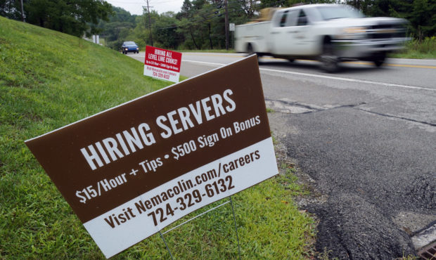 FILE - In this Wednesday, Sept. 2, 2020, file photo help wanted signs for servers and cooks at Nema...