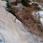 This satellite image provided by the National Oceanic and Atmospheric Administration (NOAA) at 15:31 UTC (7:31 a.m. PDT) on Wednesday, Sept. 9, 2020, shows brown smoke from wildfires blowing westward, from California's Sierra Nevada to the Coast Ranges, at center to left, and from Oregon at top left, affecting air quality throughout the West. Smoke mixes with clouds and overcast along the coast. Millions of acres of wildland and many homes and other structures have been lost to the flames. (NOAA via AP)