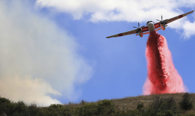 Cal Fire air tankers help stop the spread of a brush fire in Larkfield Calif, Thursday, Sept. 24, 2...