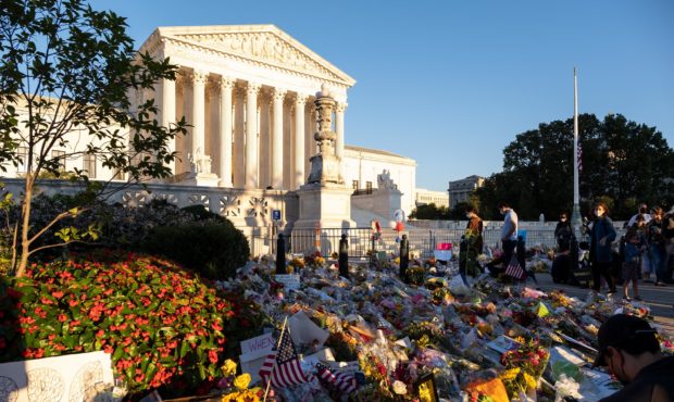 Flowers and notes are placed outside of the Supreme Court to honor Supreme Court Justice Ruth Bader...