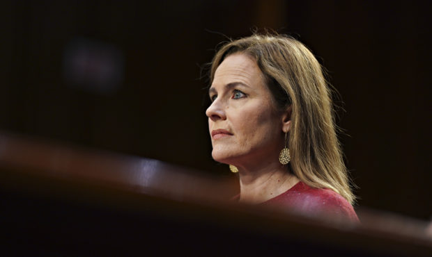 FILE: Supreme Court nominee Amy Coney Barrett listens during a confirmation hearing before the Sena...