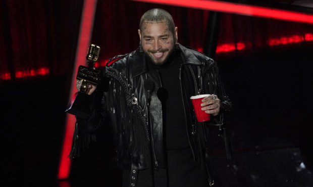 Post Malone accepts the top artist award at the Billboard Music Awards on Wednesday, Oct. 14, 2020,...