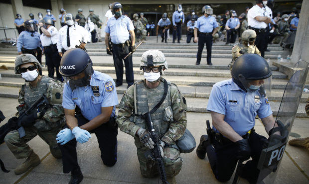 FILE - In this June 1, 2020, file photo, Philadelphia police and Pennsylvania National Guard take a...