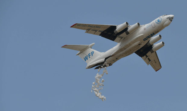 A Russian-made Ilyushin airlifter aircraft leased to the World Food Programme (WFP) makes a drop of...