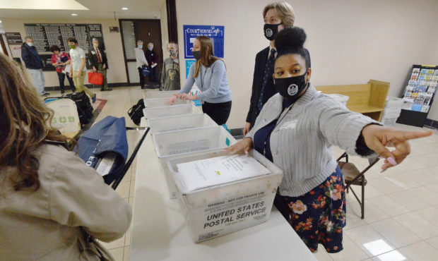 Marian Collin Franco, 20, helps collect provisional ballots at the Erie County Courthouse on Electi...
