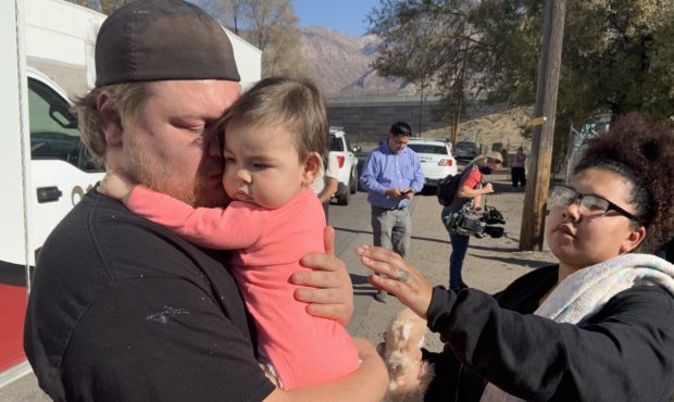 (Collin Apke, holding his daughter, Amila Spratley, after she was safely returned.  Amila's mother ...