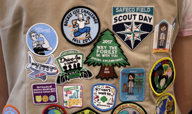 FILE - In this June 18, 2018, file photo, patches cover the back of a Girl Scout's vest at a demons...