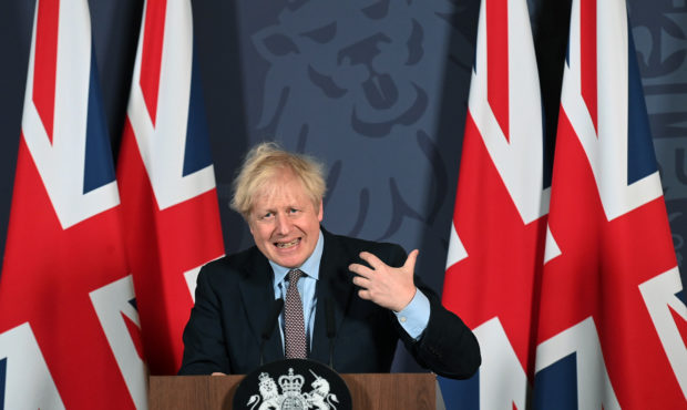 FILE - In this file photo dated Thursday, Dec. 24, 2020, Britain's Prime Minister Boris Johnson spe...