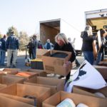 Katie Graham, member of the Christkindlmarkt SLC committee, helps load donated boxes in a truck. Nearly 800 COVID-19 kits and 700 education backpacks were collected and donated for families on the Navajo Nation.

(The Church of Jesus Christ of Latter-day Saints)