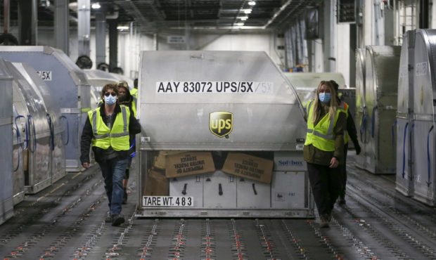 LOUISVILLE, KY - DECEMBER 13: UPS employees move one of two shipping containers containing the firs...